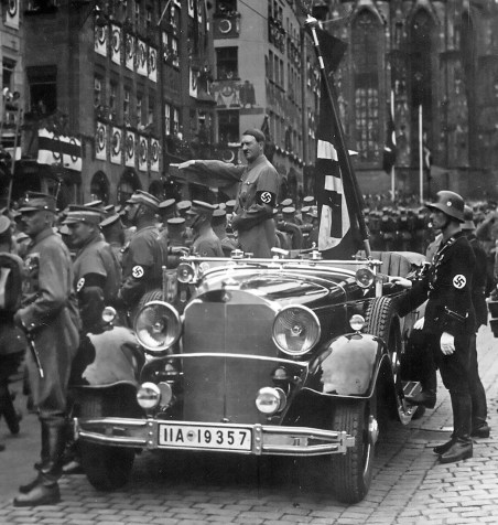 SA troops parade past Hitler at the 1935 Nuremberg Rally